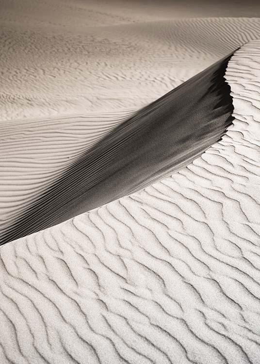 –Fotografía de un paisaje con dunas de arena. 