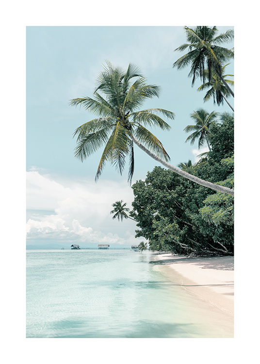  – Fotografía de un paisaje tropical con una playa con palmeras y mar azul