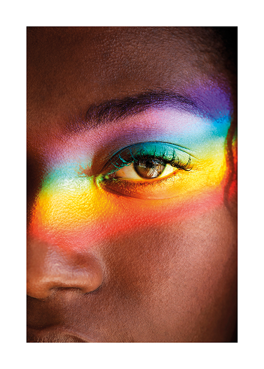  – Fotografía de un ojo marrón con un arcoíris pintado encima